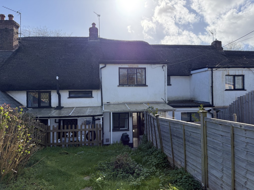 Lot: 26 - TWO-BEDROOM COTTAGE FOR IMPROVEMENT IN POPULAR DEVON VILLAGE - Rear aspect of the property